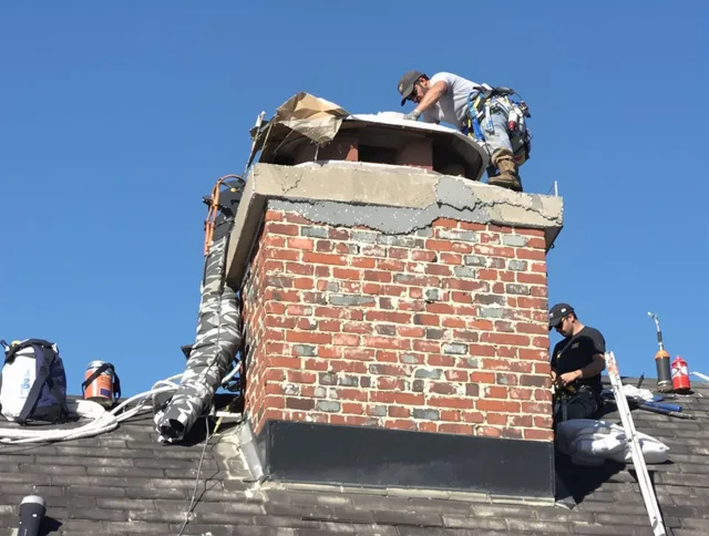 Stamford Chimney Sweep installing a custom chimney crown in Stamford, CT
