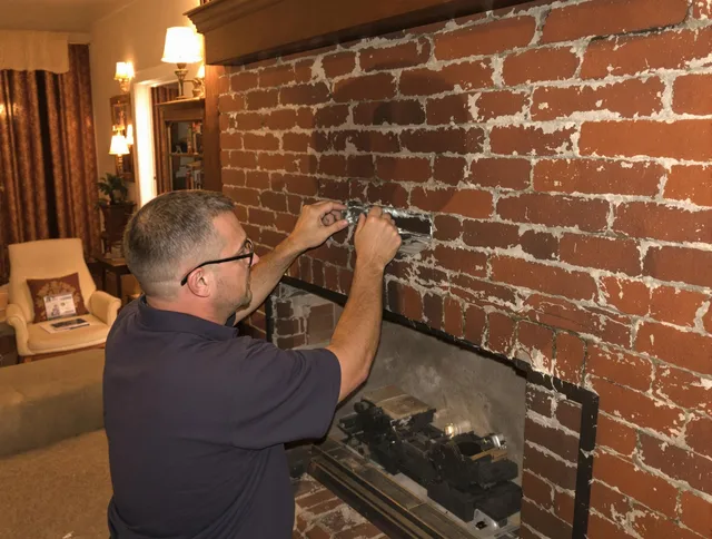 Stamford Chimney Sweep expert fixing a fireplace in Stamford, CT